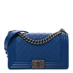 Caviar Quilted Medium Boy Flap Dark Blue