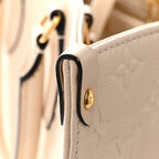 Empreinte Monogram Giant Onthego MM Creme